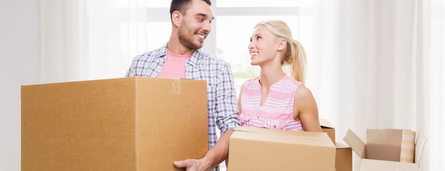 photo of a happy couple smiling at each other because of the professional services of London Man and Van