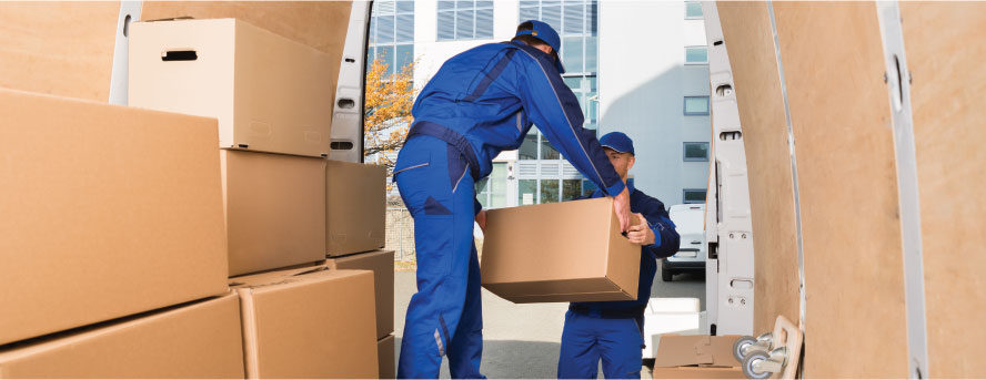 photo of two movers unloading a mover truck